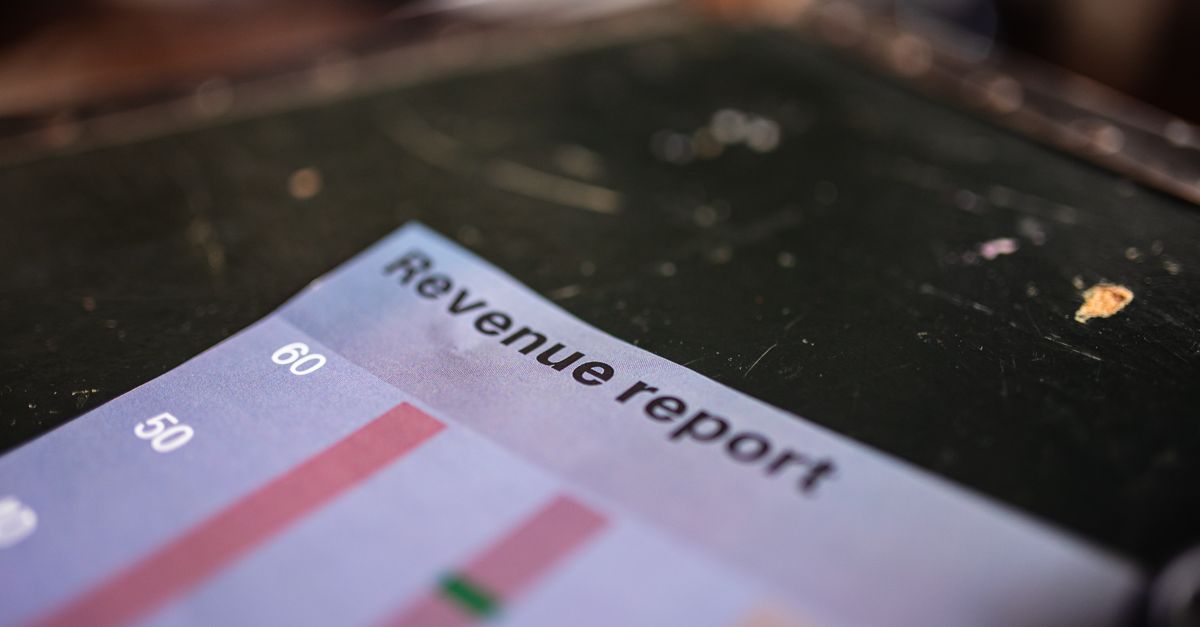 Detailed view of a revenue report featuring a bar chart in an office setting.